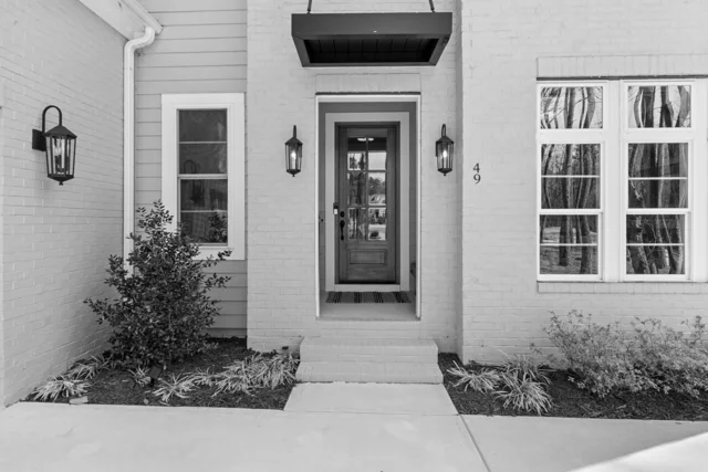 Modern entrance with a glazed wooden front door