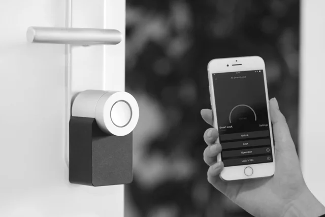 Door-mounted smart lock with phone control